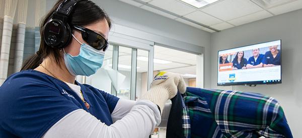 a pair of 威尼斯游戏大厅 nursing students participate in a dementia simulation